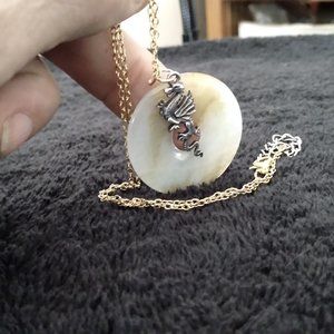 The green jade dragon with gold tone chain